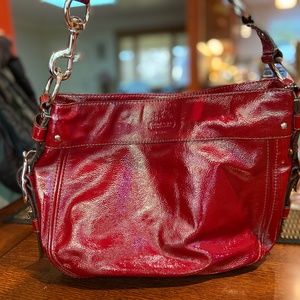 Coach women's handbag in red patent leather in great condition